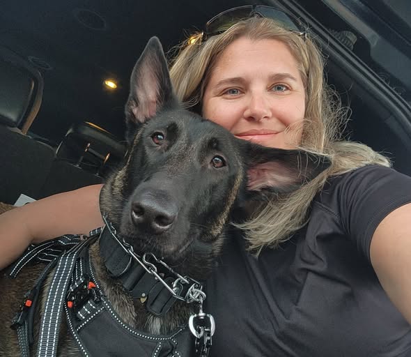 Handler with her certified mold detection K9